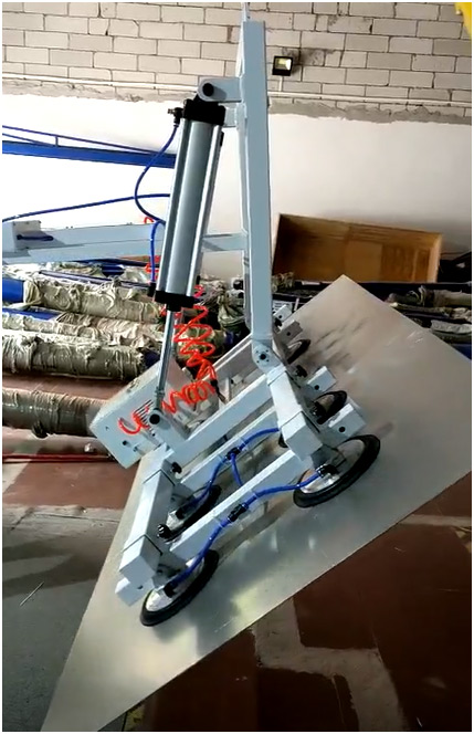 Vacuum lifter tilting large sheet steel panel to a 90-degree vertical position